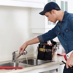 Chris working on a sink